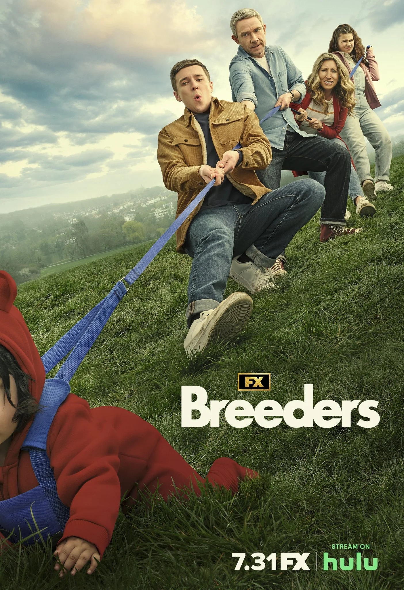 A family of five pulls a young child on a grassy hillside during the daytime, with a cityscape and clouds in the background. The image is a promotional poster for the TV show 'Breeders' on FX, with streaming options on Hulu.