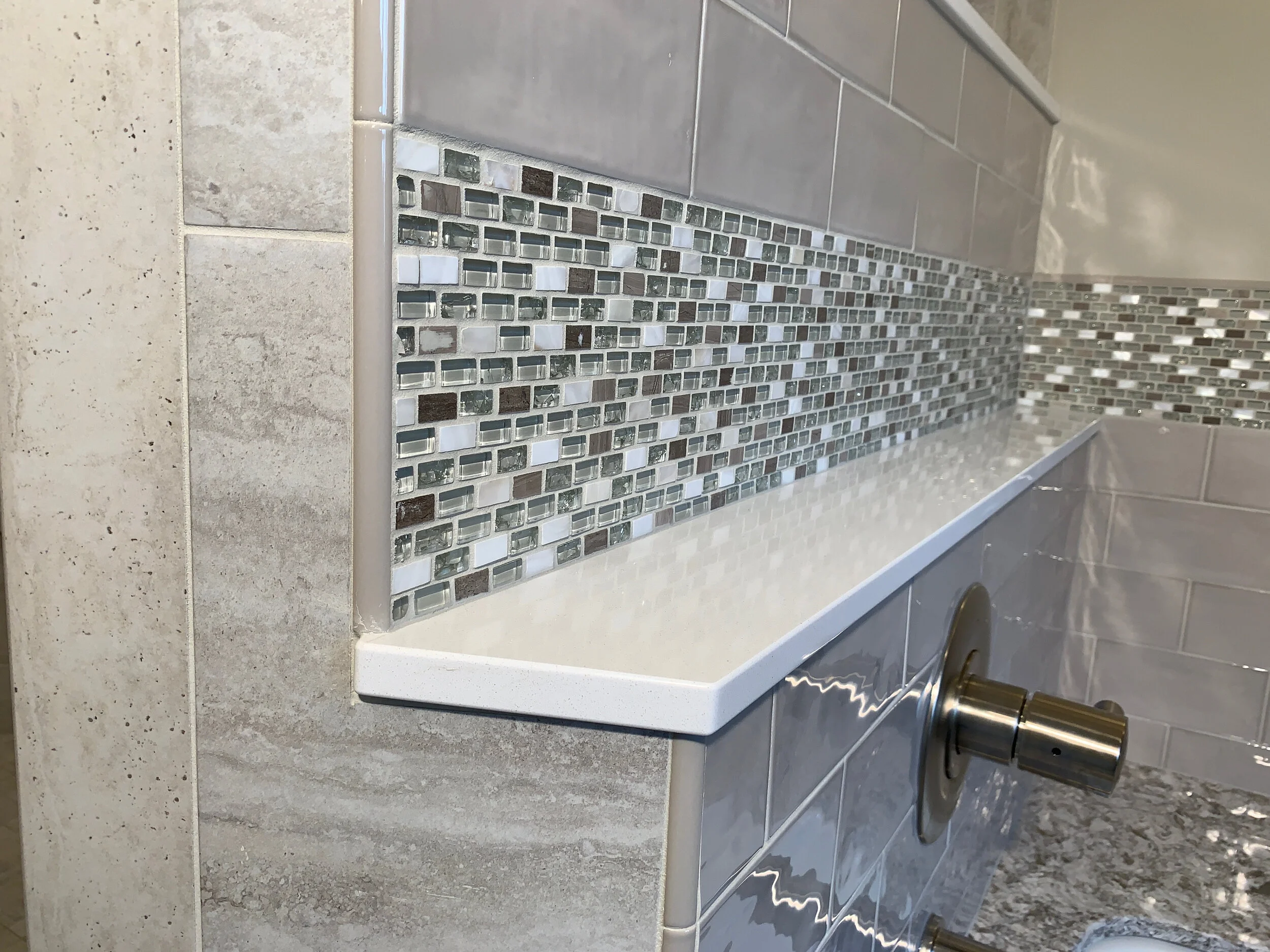 Accent tile and Cambria ledge