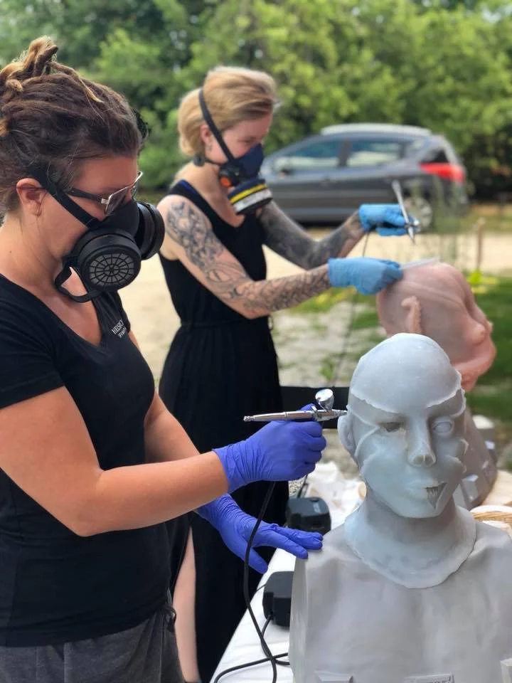 Students painting their silicone masks with airbrush during our 10-day mask making workshop at Helsinglight