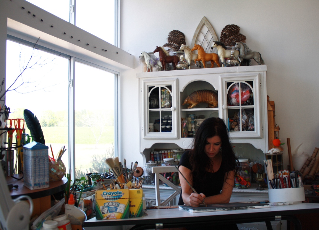 Laura at drafting table.jpg