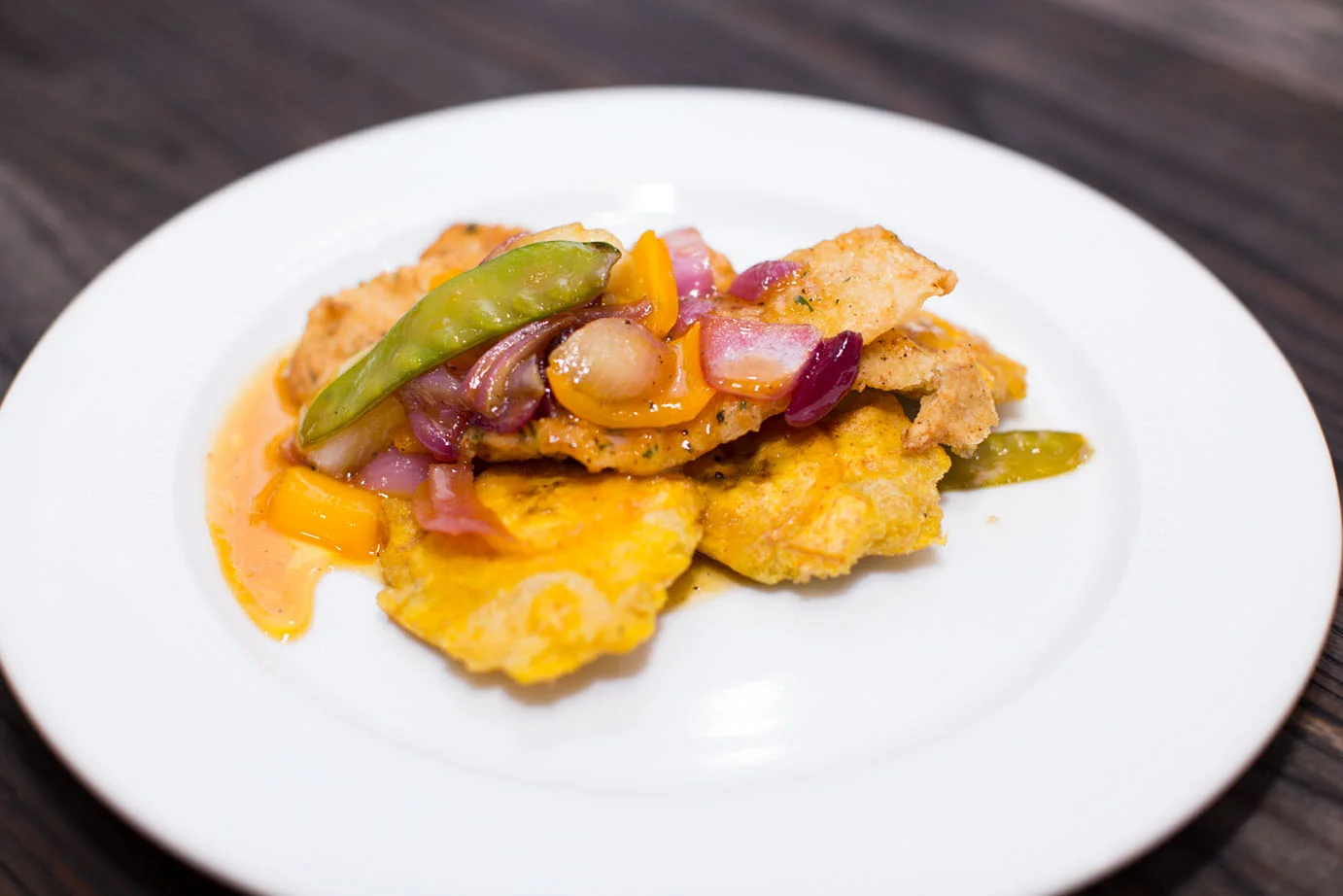 Pan Seared Snapper with Mango sauce with Tostones & Asian Stir fry.