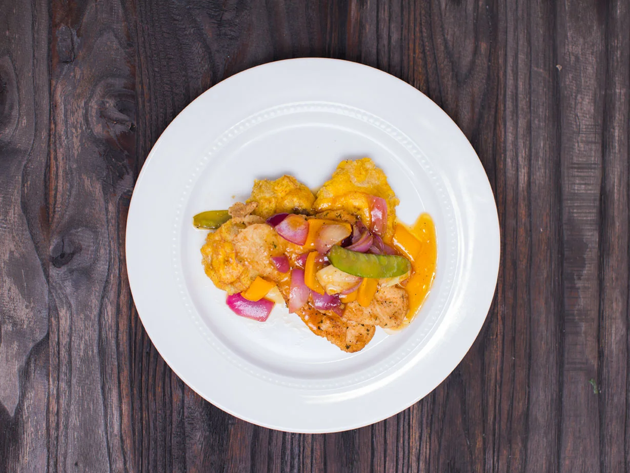Pan Seared Snapper with Mango sauce with Tostones & Asian Stir fry.