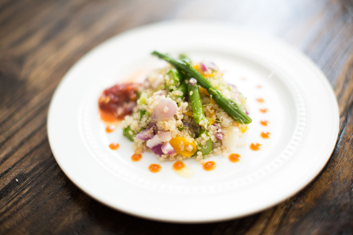 Quinoa with roasted topped with lemon scented Asparagus Spears and red Chile purée 
