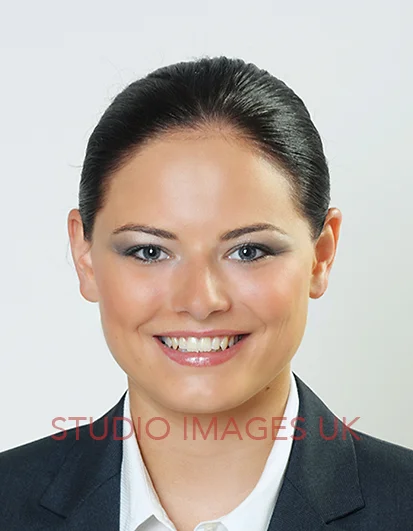HAIR Neatly tied in a French roll, braid, ponytail or bun, with loose strands pinned up or to the side.