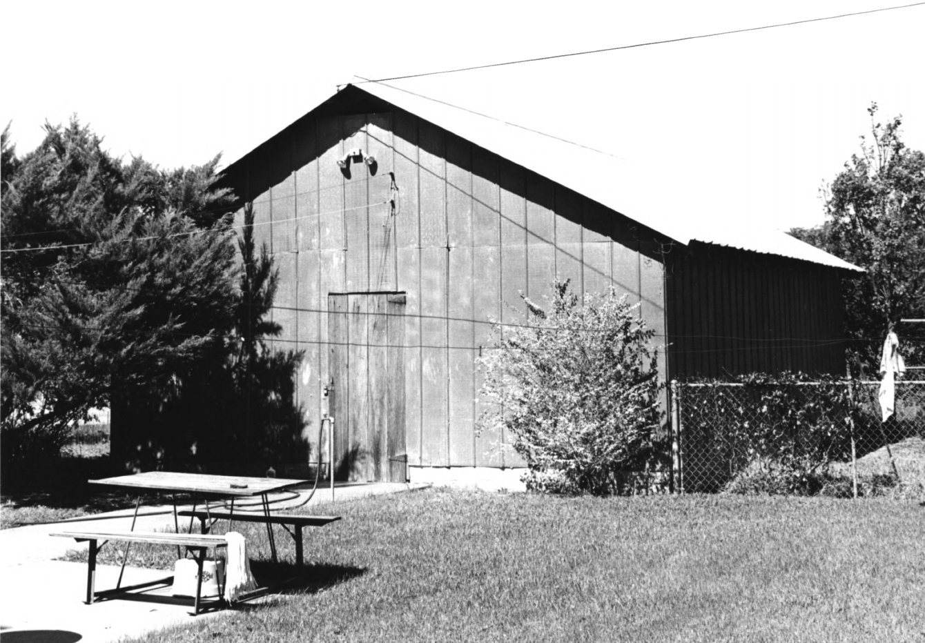 Photo of historic garage from national register of historic places, taken in 1990.