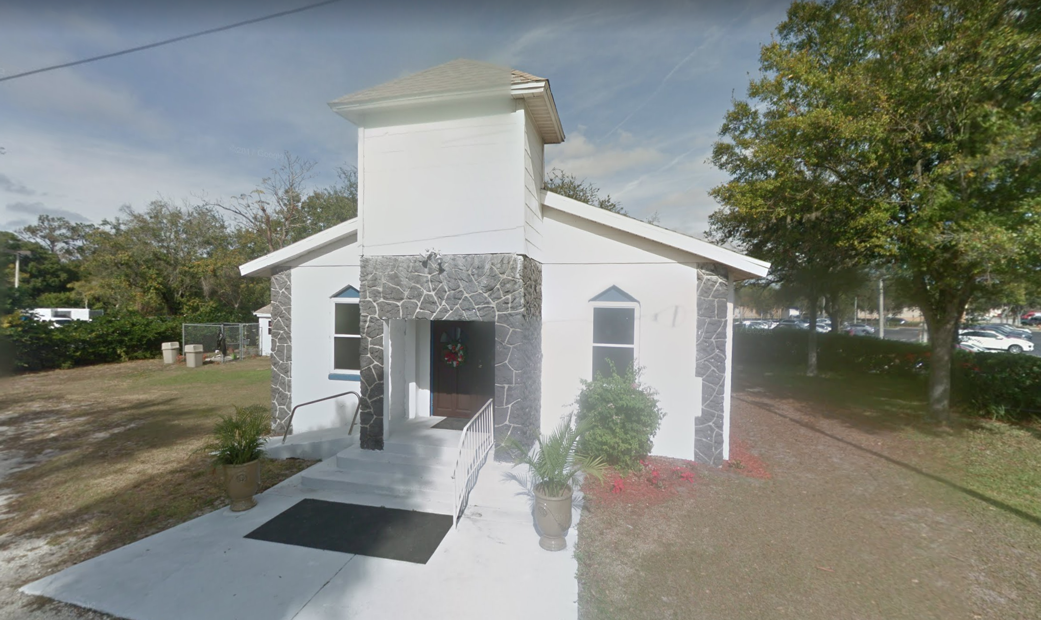 Google Street View of the new church building, tucked next to the Porsche dealership.