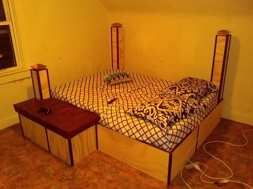 Bed frame with linen storage and end cap lights on the post