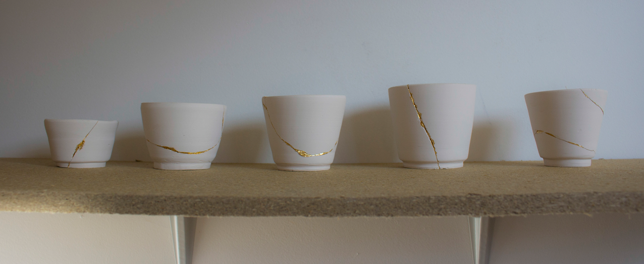 shelf-of-ceramic-pots.png
