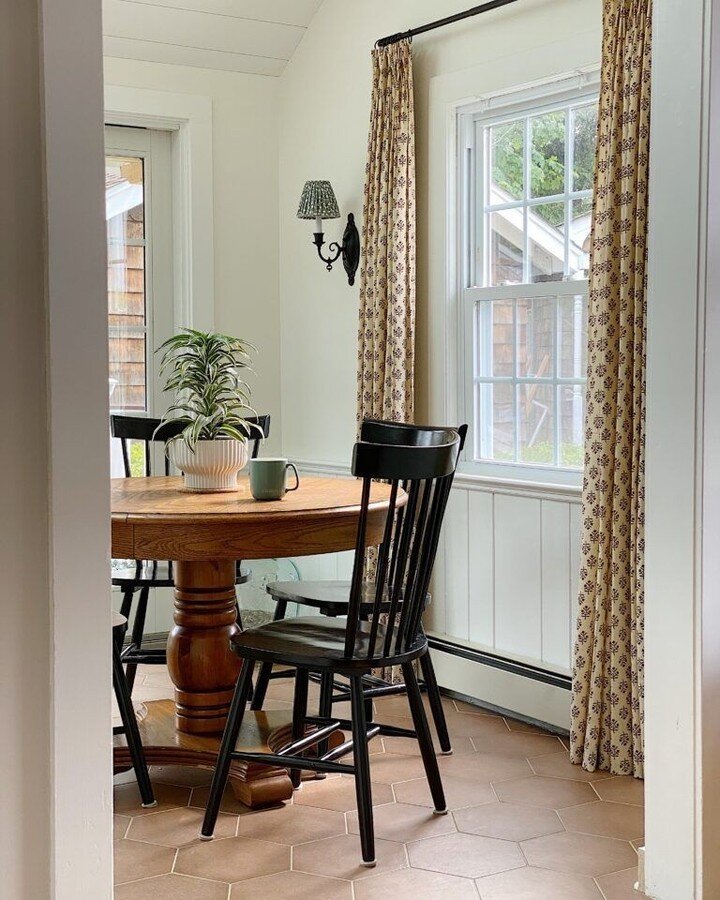 This dreamy breakfast area is by @homespunstyle from the spring '22 ORC, where she renovated the galley kitchen in her 1940s coastal cottage. Part of the project included vaulting the ceilings and adding skylights, which made the space feel so much l