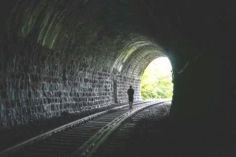 Man at the end of a tunnel representing how therapy for men can work