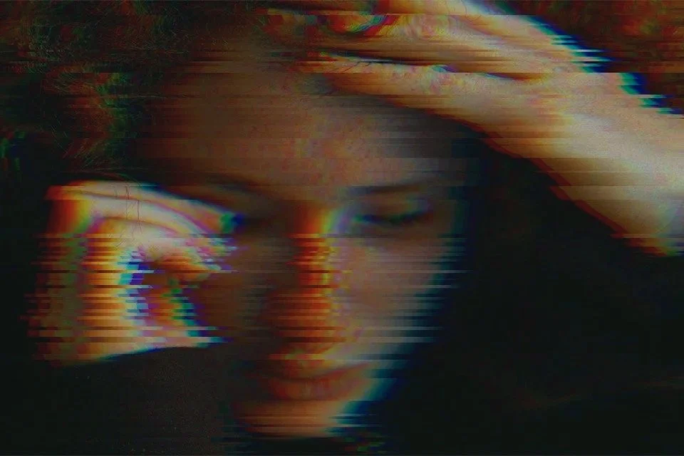 Close image of a woman representing depression and fear of asking for help