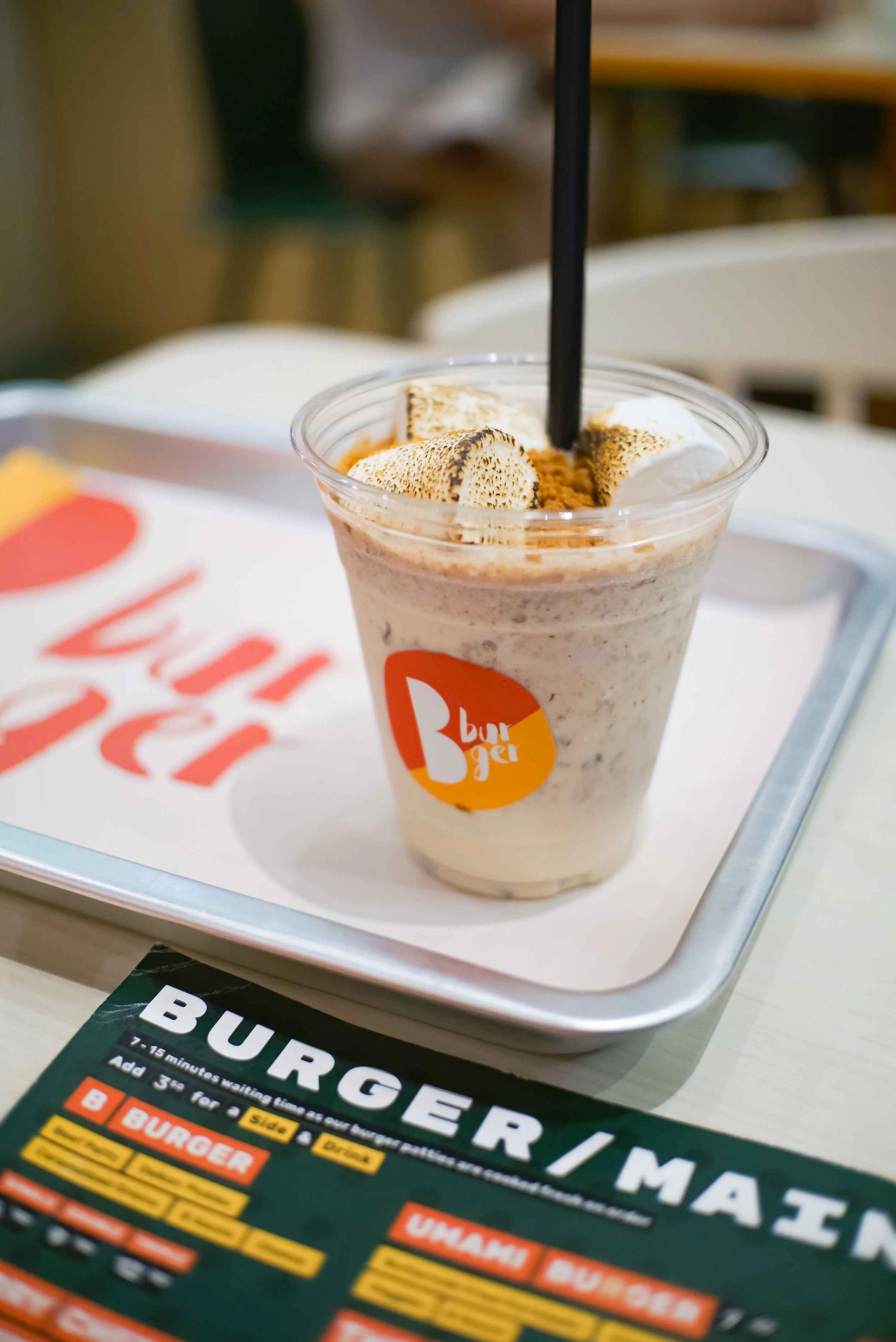 The Smores Milkshake, topped off with flamed marshmallows and Graham cracker bits.
