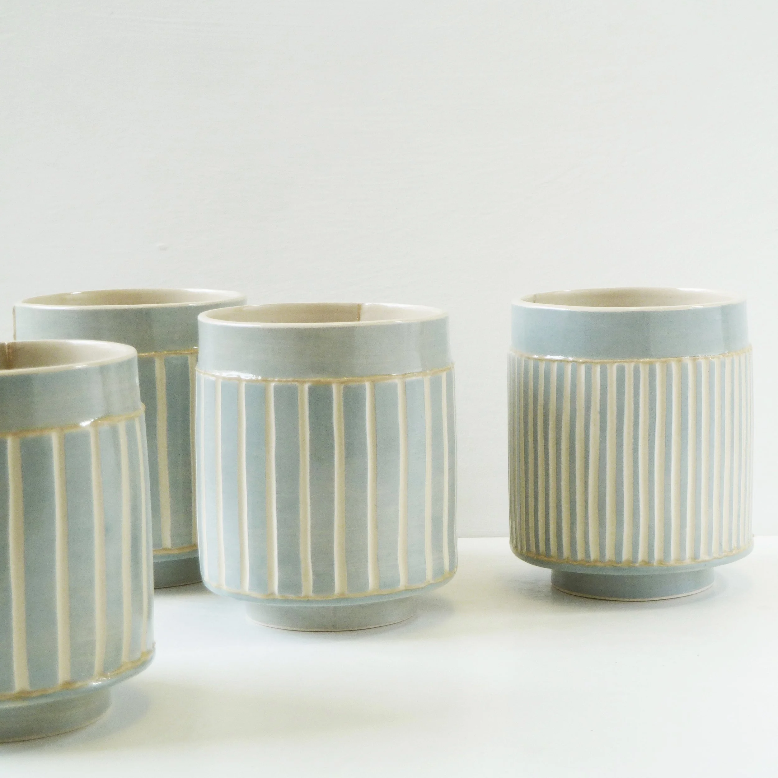 Emily-Kriste Wilcox, group of small vessels in pale blue stripe, Pattern & Surface (2).JPG