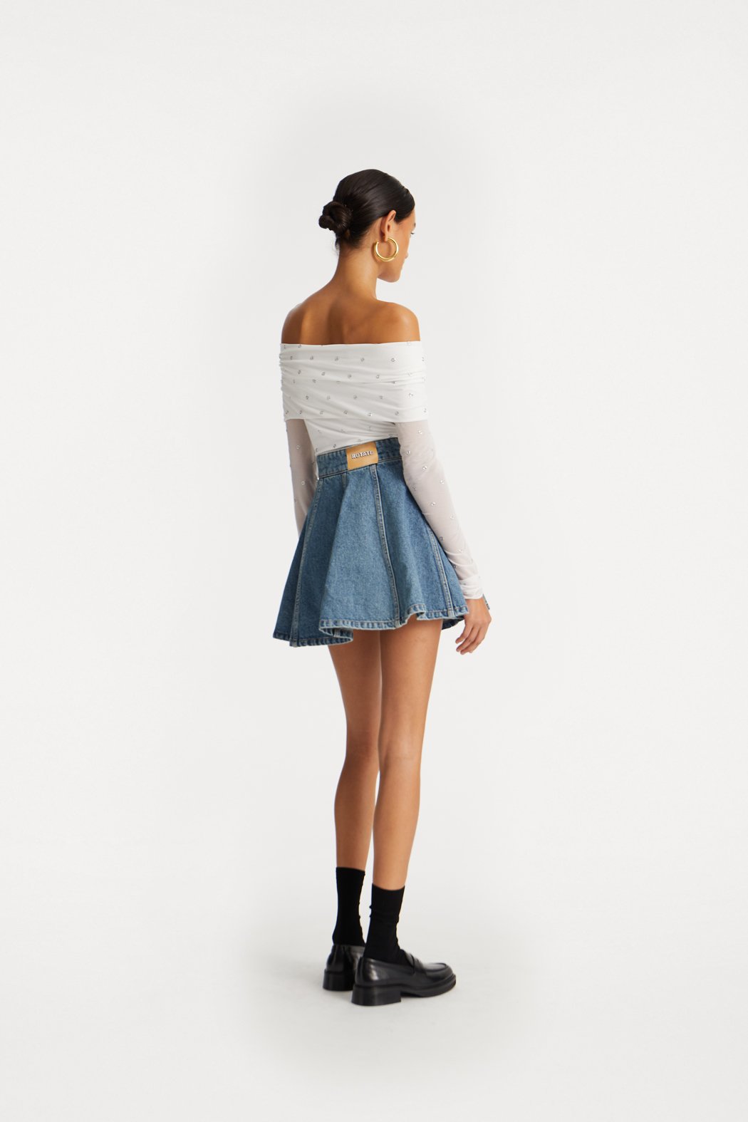 ROTATE_PF25_111124_114258400_Bright White_Off Shoulder Top_Model_ 1_1140783054_Vintage Blue, Denim_Denim Mini Skirt_Model_ 1_1105_lr_V2.jpg