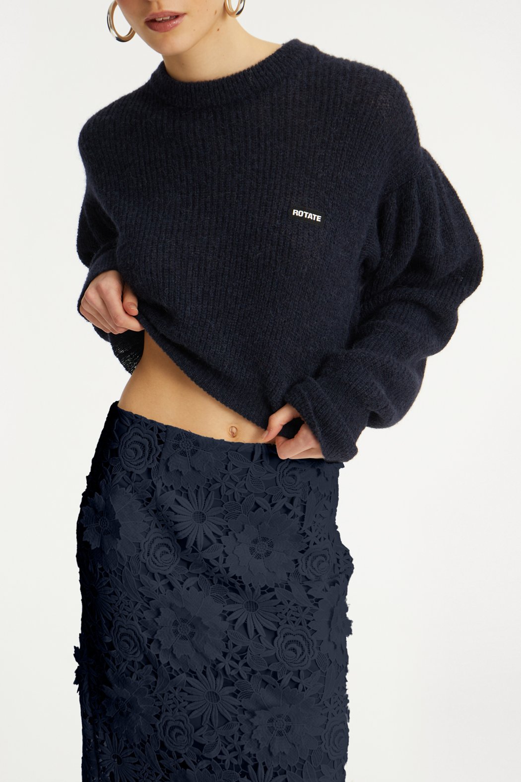ROTATE_PF25_121124_1142781725_Navy Blazer_Knit Puff Crewneck_Model_ 1_115034 1725 _Navy Blazer_3D LACE PENCIL SKIRT_Model_ 1_3266_Navy_lr.jpg