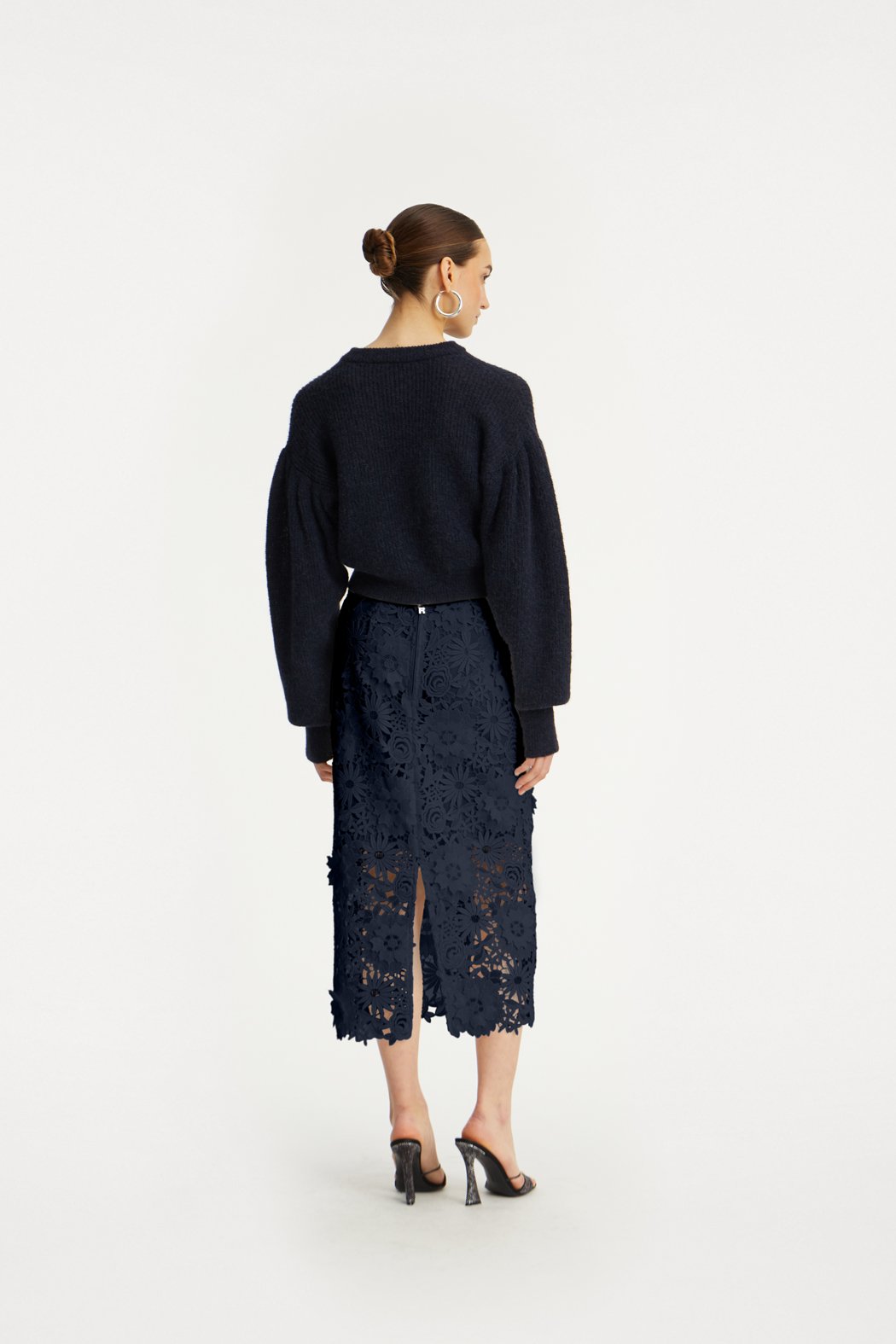 ROTATE_PF25_121124_1142781725_Navy Blazer_Knit Puff Crewneck_Model_ 1_115034 1725 _Navy Blazer_3D LACE PENCIL SKIRT_Model_ 1_3236_Navy_lr.jpg