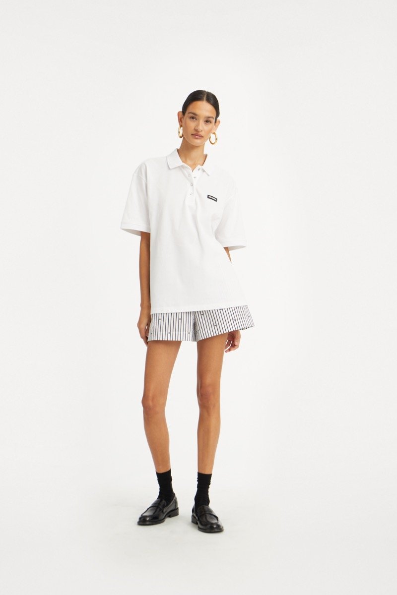 rotate_pf25_191124_114785400_bright_white_cotton_short_sleeved_polo_model__1_114396000_1000_black_comb._poplin_shorts_model__1_1435_lr.jpg