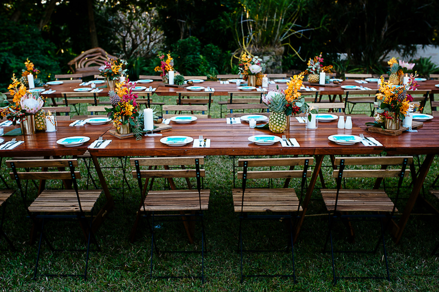 timber table tops with pineapples and flowers at Darwin Botanic Gardens