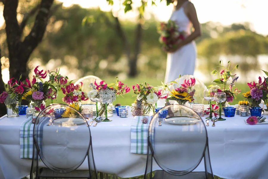 Copy of flower filled guest tables overlooking Lake Alexander at East Point