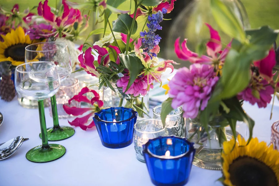 guest table flowers include NT grown zinnia, gloriosa and sunflowers