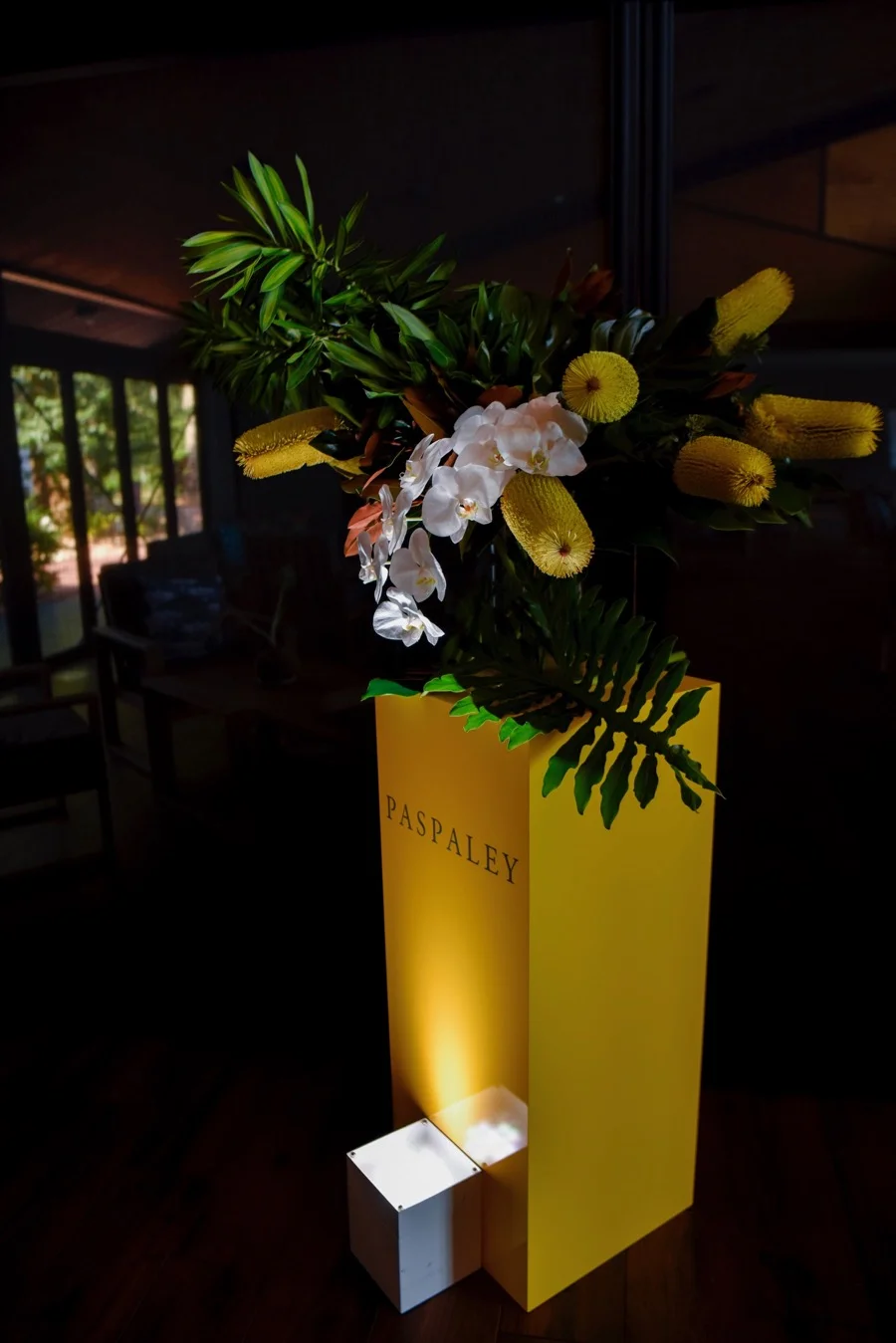 Beija Flor florists created floral arrangements of banksia and phalenopsis orchids to frame the entrance to Pee Wees