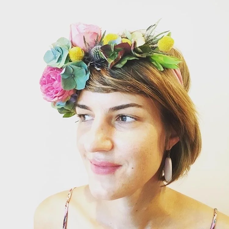 Maria Okwa wears flower crown at Darwin, NT, Australia