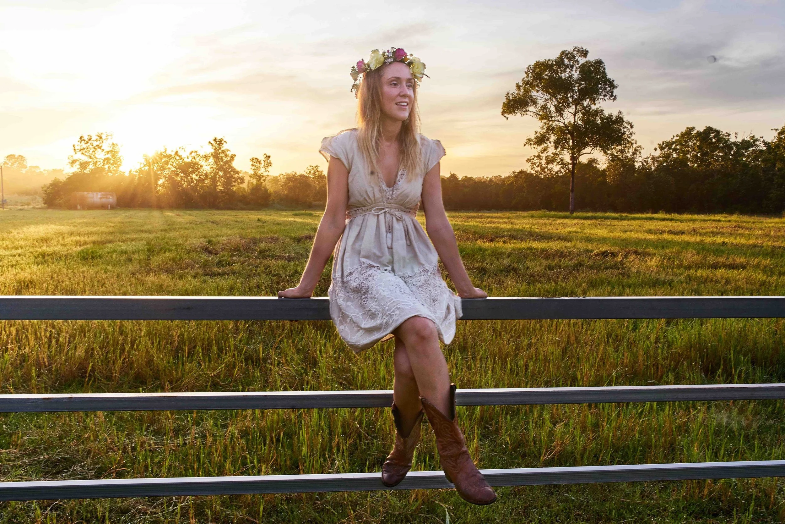 sunrise over the paddock, Catherine Beard of Two Seasons Co. wears flower crown created by Beija Flor florist Maria Okwa