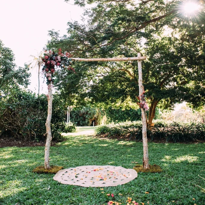 rustic wedding arbour with native flowers for hire for Darwin Botanic Gardens wedding ceremony