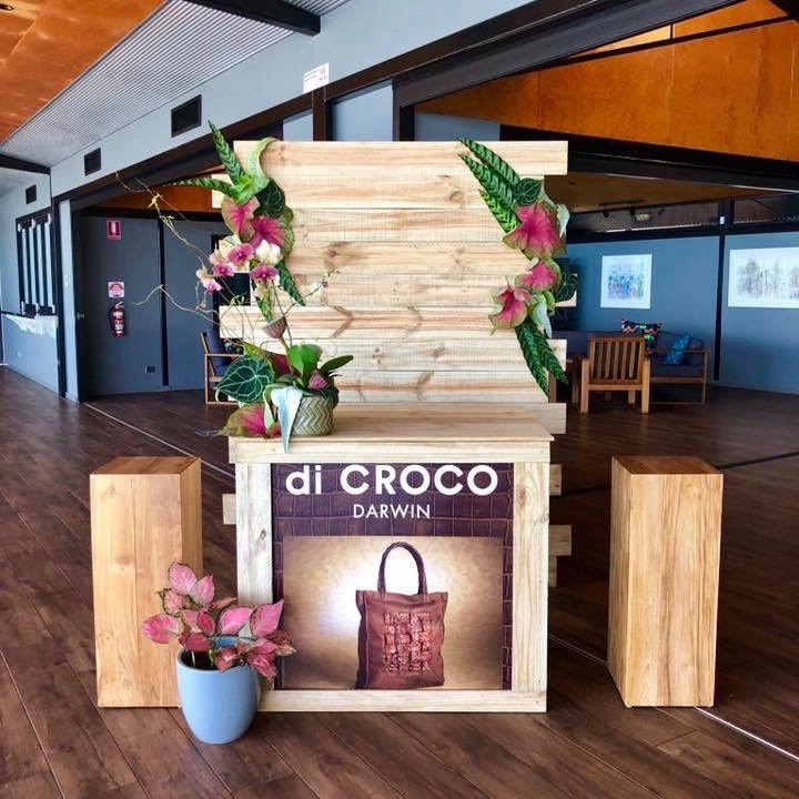 floral styling for Darwin brand, di Croco, using tropical leaves and timber pillars, at Pee Wees in Darwin