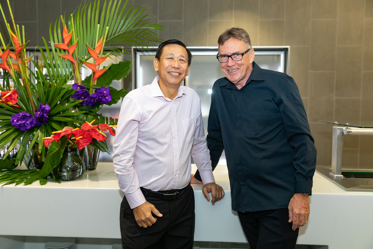 The Virgin lounge at Darwin International Airport, with floral branding in Virgins, red and purple shades.