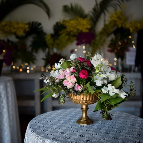 Fresh flower filled centrepieces in gold bowls