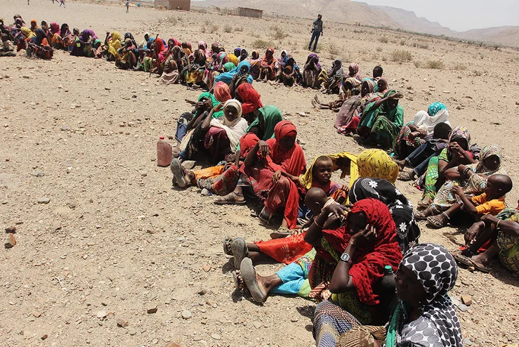 Families in Ethiopia wait to receive food and supplies during the 2011 East Africa Crisis