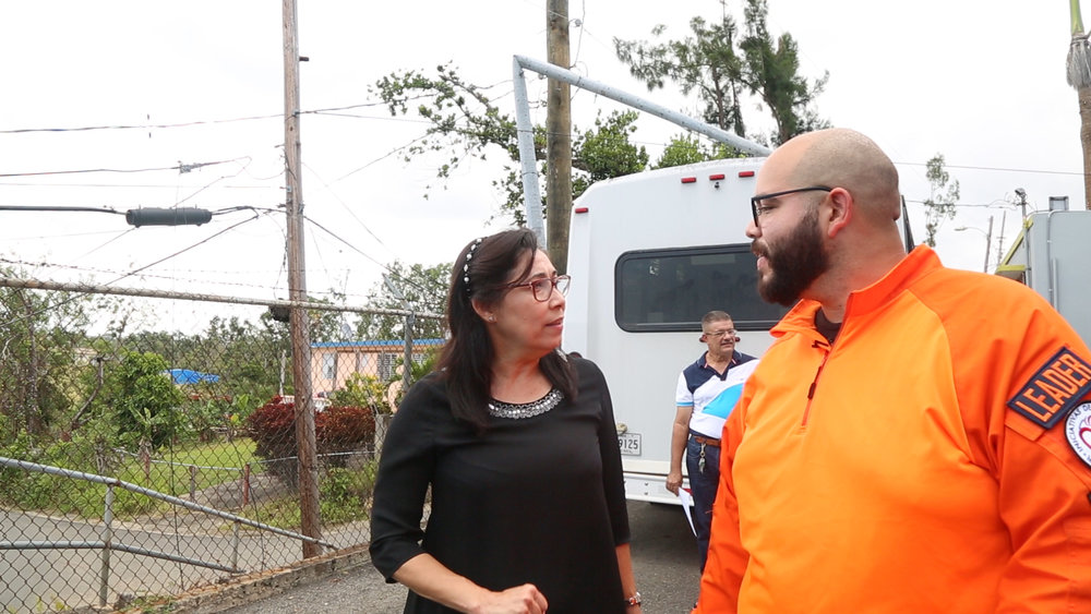  Jose Varguez talks logistics with one of the community leaders. 