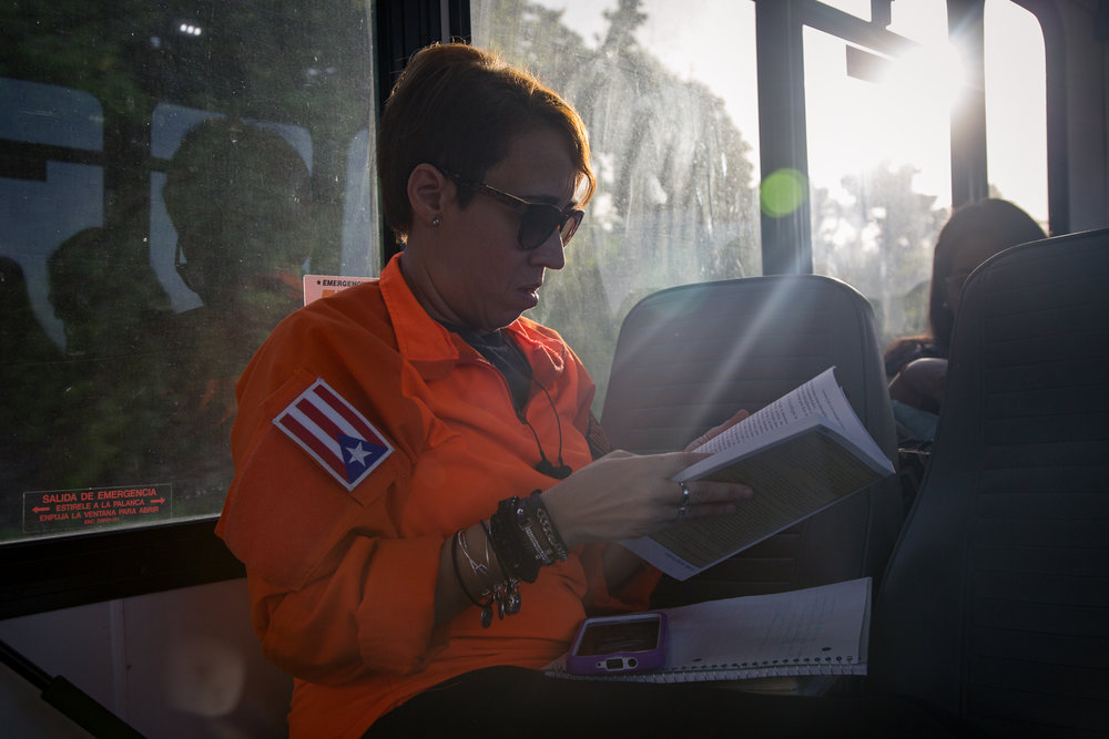  Ingrid Morales looks over some notes on the way to the community. 