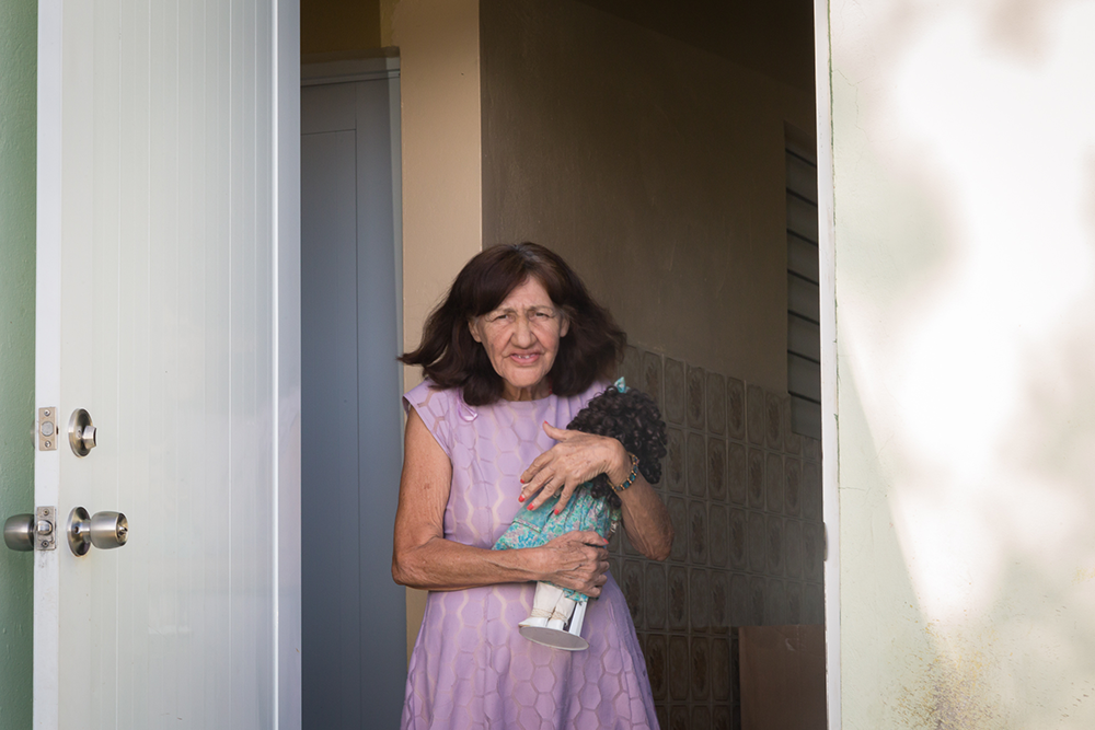Julia has been living alone since her family moved to the US. Ingrid, of Iniciativa Communitaria, gave her a doll to keep her company.