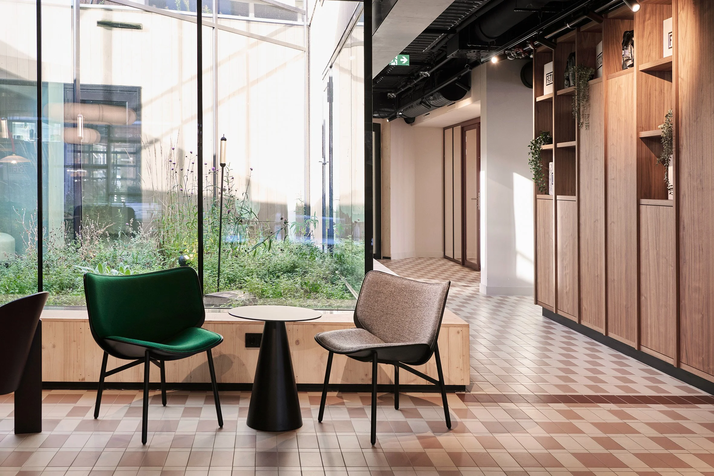 KBF Warehouse entrance with walnut joinery and courtyard view.