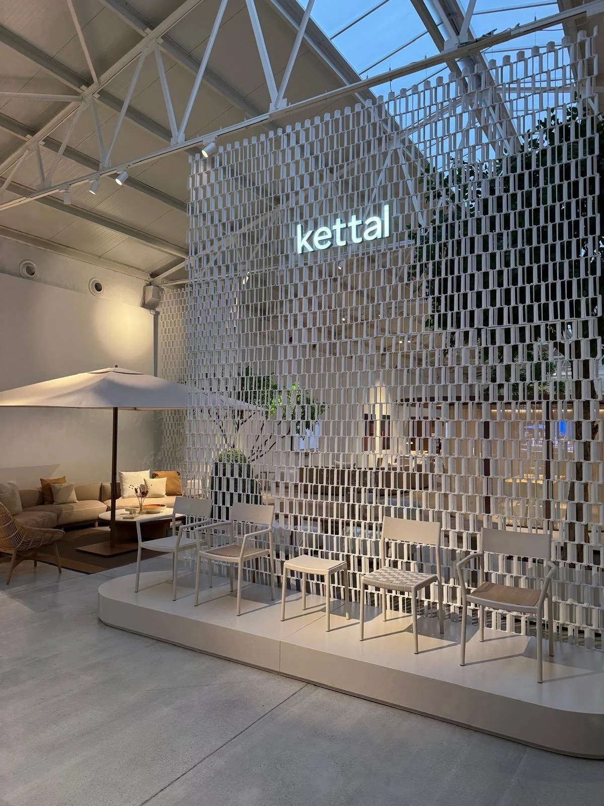   Kettal detail:  Close-up of the Kettal branding integrated onto the Nazka Screen structure at Salone del Mobile. 