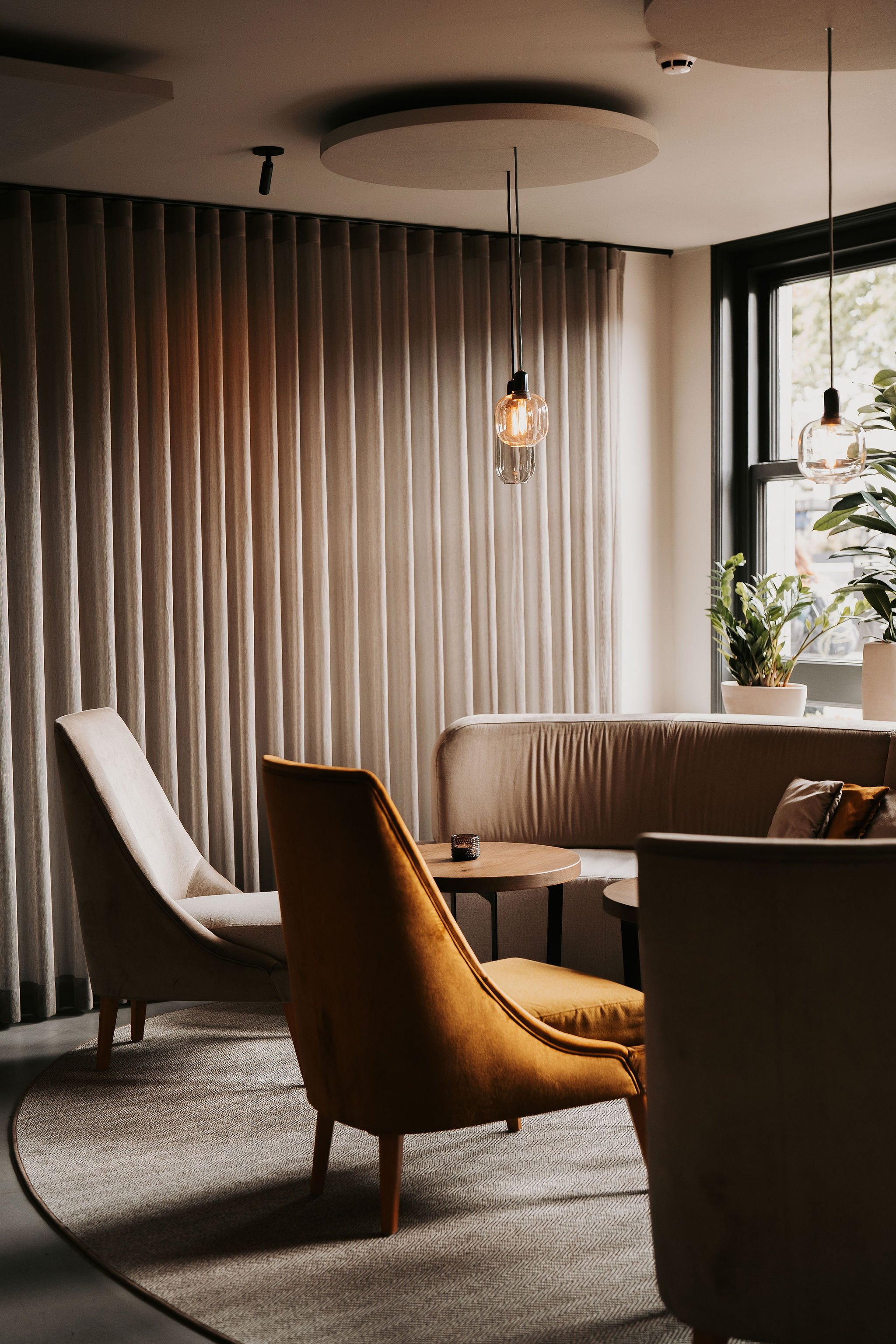 Seating detail: Comfortable restaurant banquette seating designed for an intimate and exclusive dining experience.