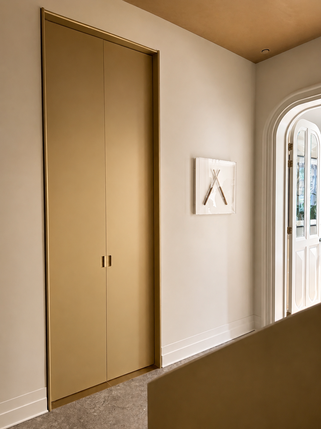 23. Monumental matte portal: A tall, monumental yet clean closed doorway finished in a sophisticated matte lacquer by Studio Michiel Wijnen.