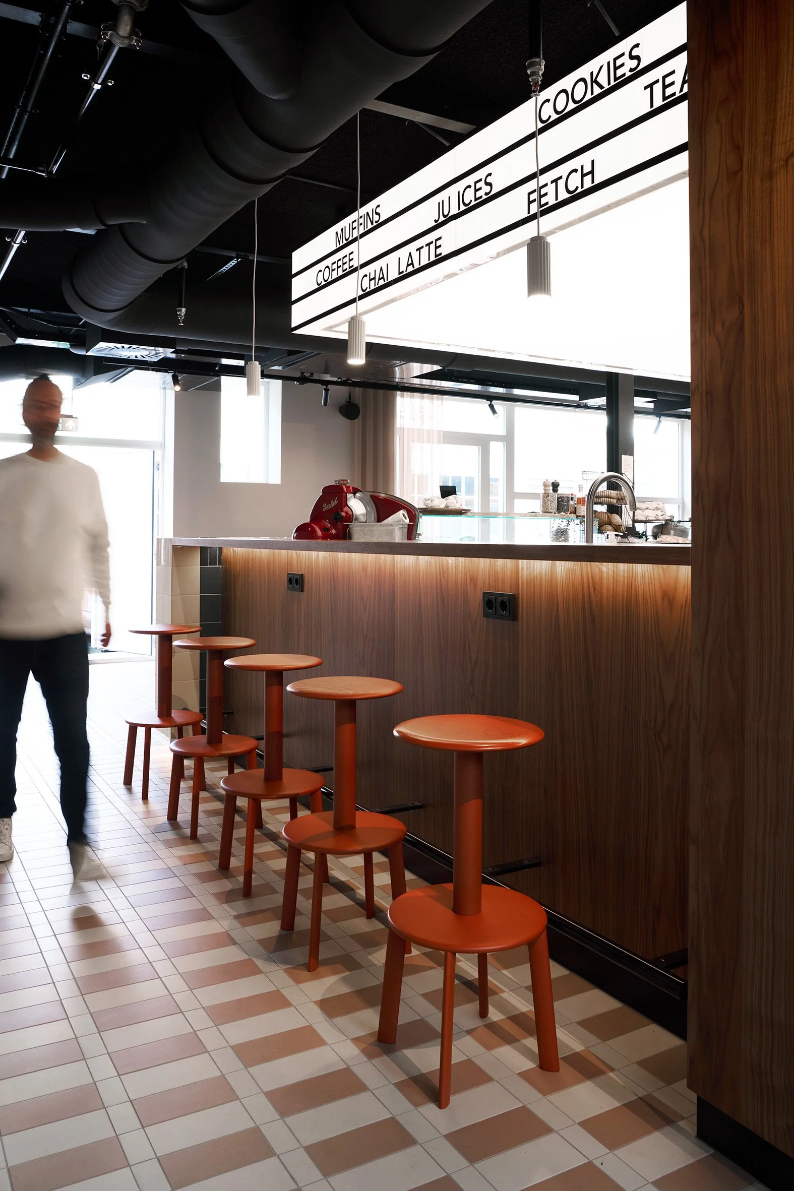 Deli counter with red &Tradition stools at KBF Warehouse.