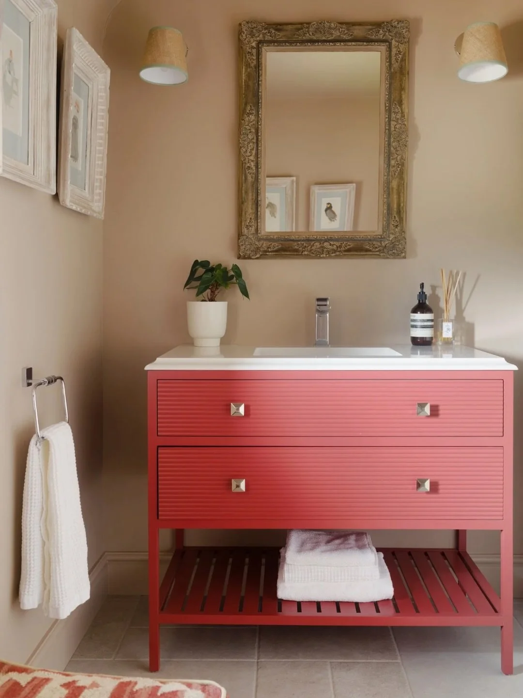 Part of a wider home transformation, this once dreary downstairs loo is now a warm and inviting cloakroom. 

Clear red set against earth-toned walls brings depth and contrast, proving that even the smallest spaces can make a big design statement.

Wa