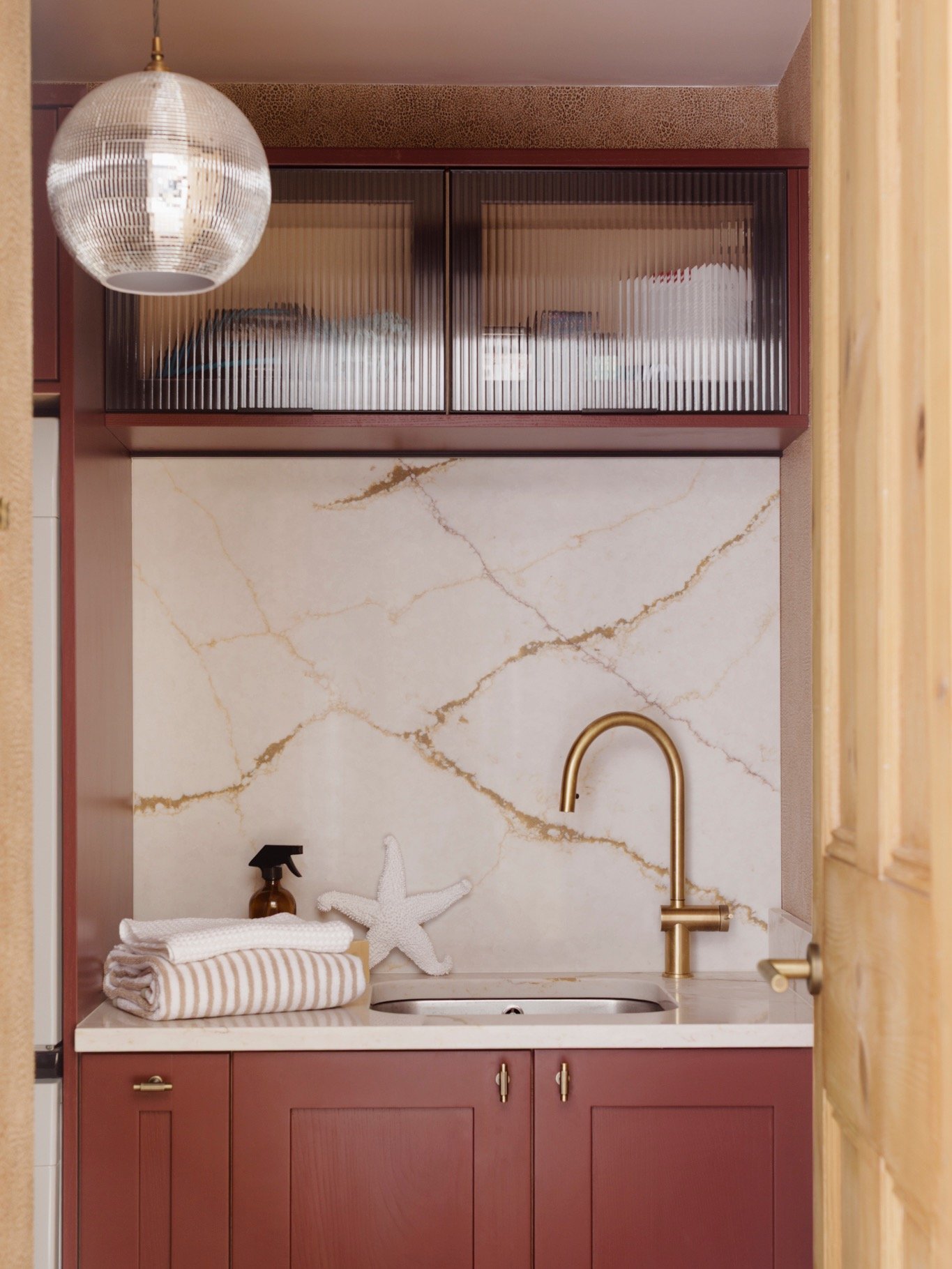 Small but mighty, this laundry room was one of those spaces we had a lot of fun with 🪩

We kept the layout considered and practical: a washer/dryer stack tucked into a compact utility run, with a sink positioned to the right, giving us the perfect o