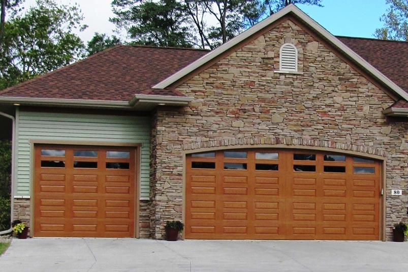 Fiberglass Doors. Our fiberglass doors look like wood garage doors but offer lower maintenance.