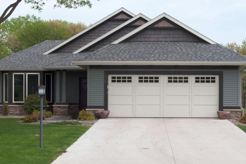 Courtyard Collection. Insulted steel garage doors made to resemble a hand crafted wood garage door.