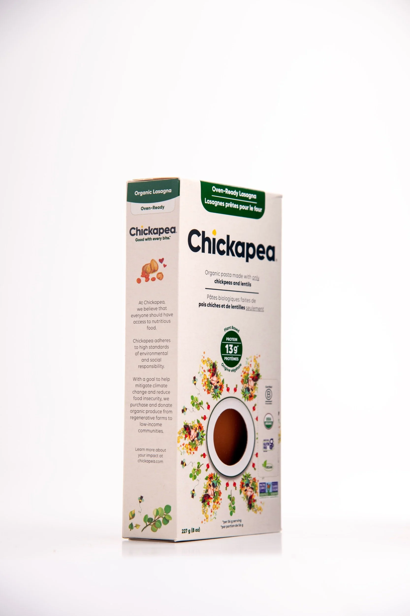 A carton of Chickapea organic pasta made from chickpeas and lentils, with front and side labels, decorated with illustrations of plants and vegetables.