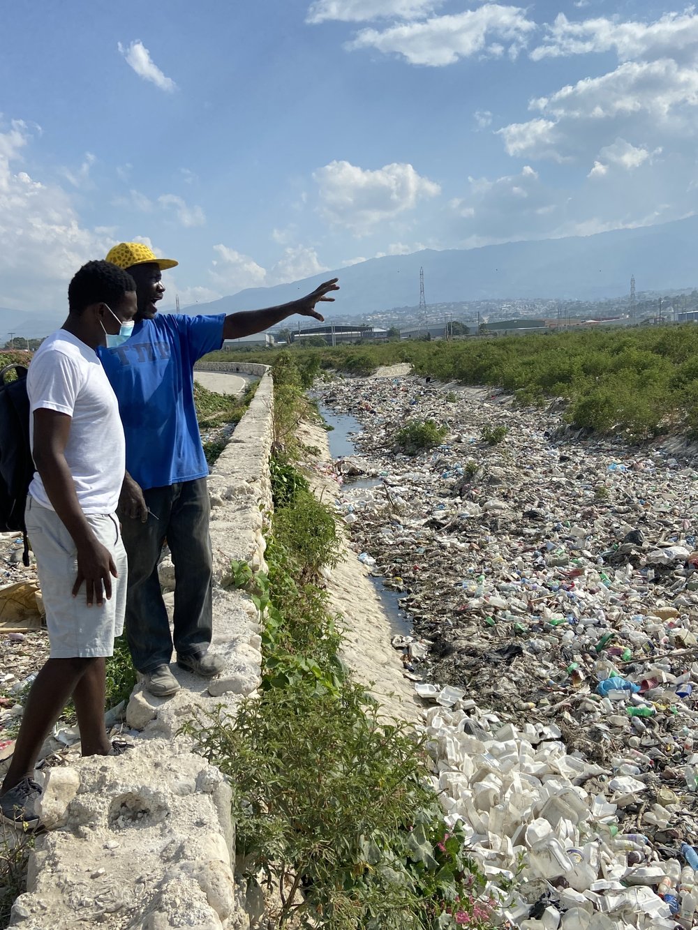  Jean Nause, one of our center owners in Port-au-Prince is discussing his vision for how to safely gather the valuable plastic material out of canals across the Port-au-Prince. 