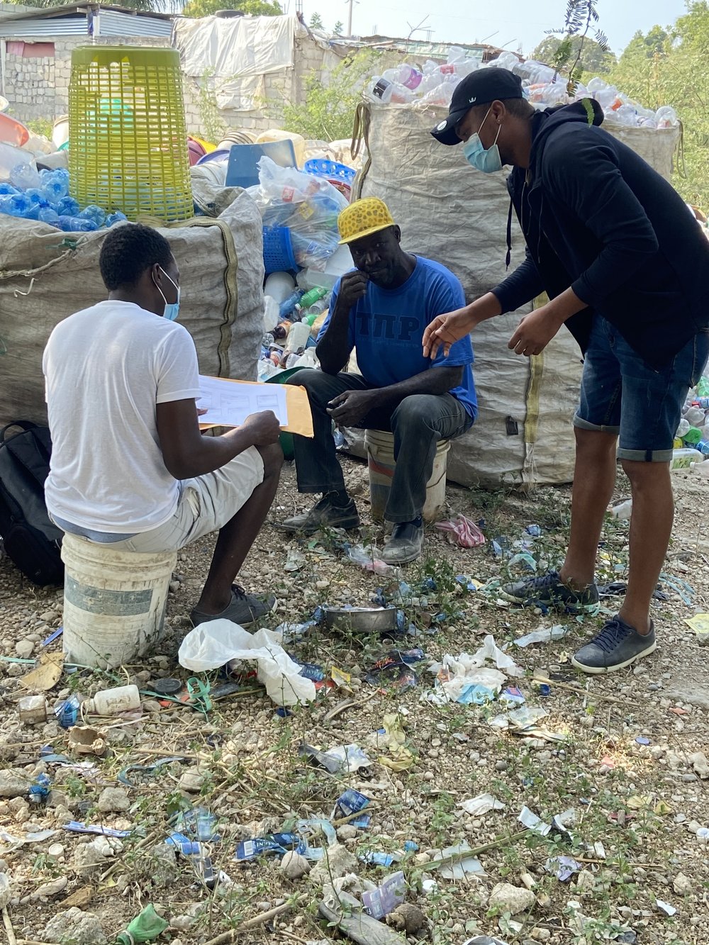  Here’s our team working on-site with a center owner to establish a budget for his business, along with a growth plan that will support living income for his collectors. 