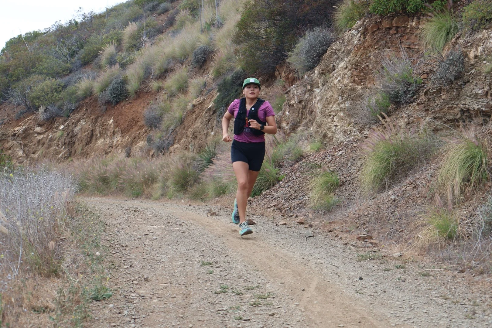 Woman running on trail