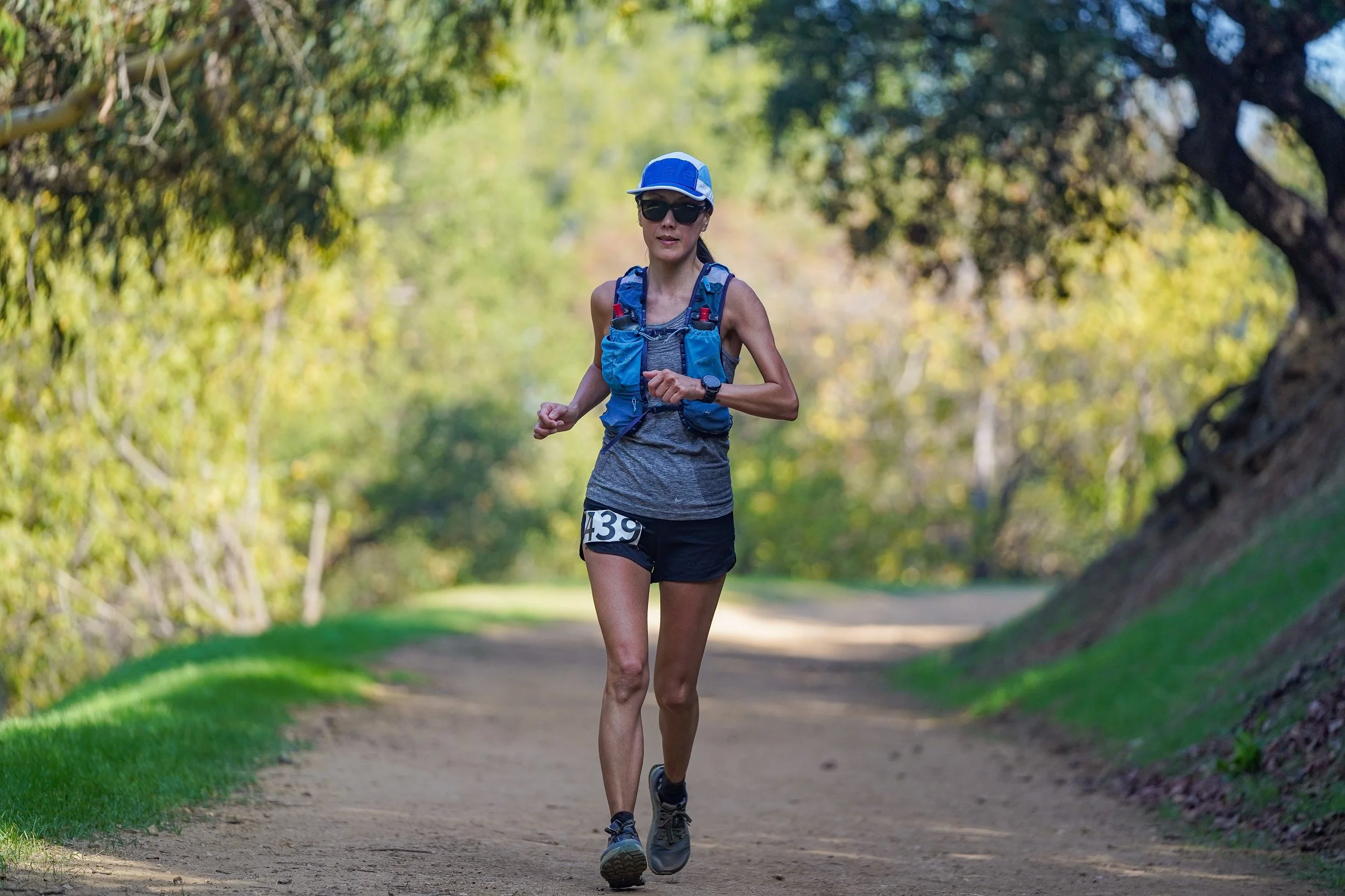 A woman running on a trail