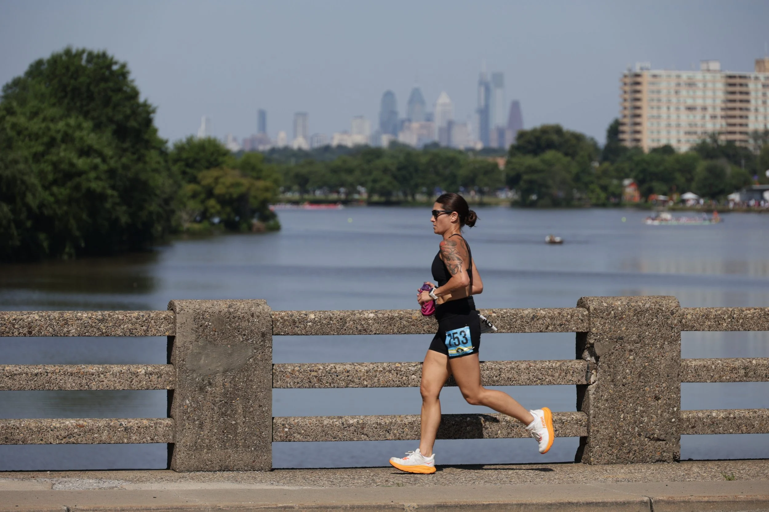 A woman running on a bridge